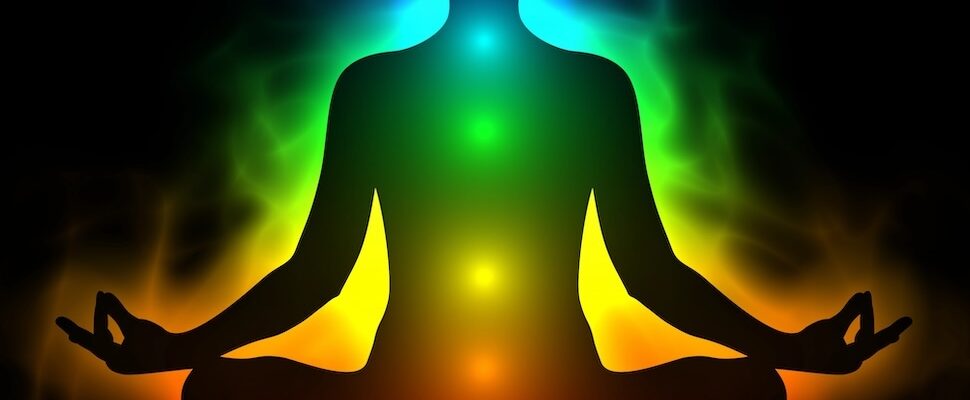 Silhouette with aura energy and layers of the aura
