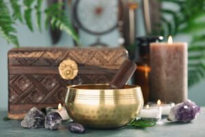 healing energy tools with singing bowl, crystals, essential oil candles