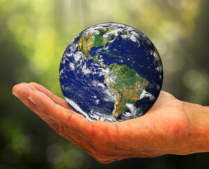 Globe in a hand for earth energy with the earth star chakra