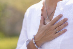 Hand on the heart or Anahata for how to balance your heart chakra