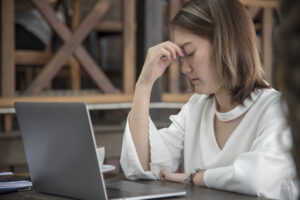 Worried worker at her desk for lack of confidence at work