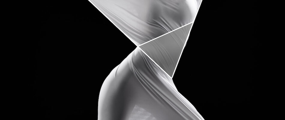Women trying to get unstuck from translucent cloth for clearing energy blocks with IET
