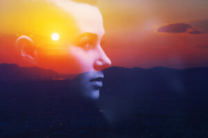 Double exposure face over sunset for chakra imbalances reveal your story of pain
