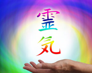 Hand with Reiki symbols for Finding the right Reiki Master or Reiki Practitioner